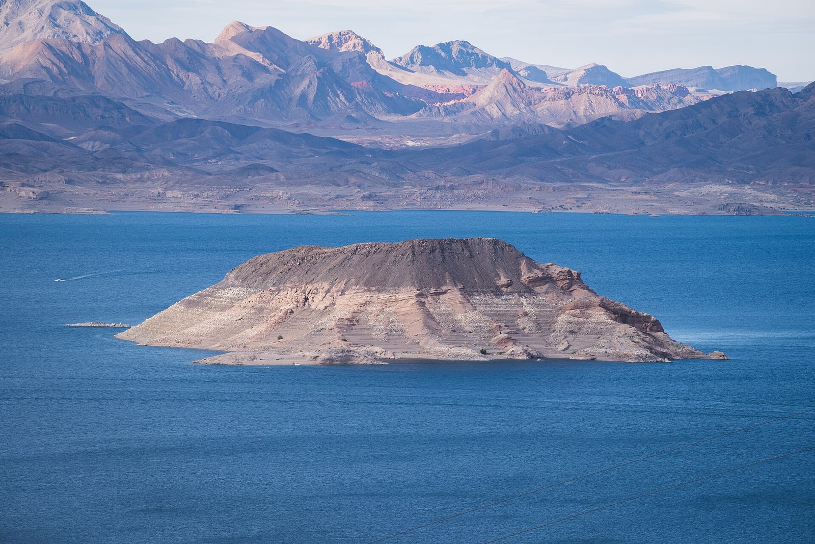Sentinel Island and desert mountain ranges across the blue water of Lake Mead